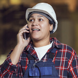 construction worker wearing hardhat on the phone