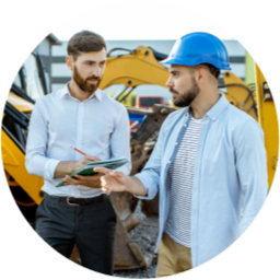 Equipment manufacturer employees talking on a jobsite