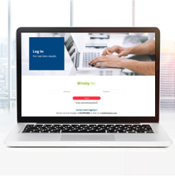 Laptop showing Winsby portal login page 