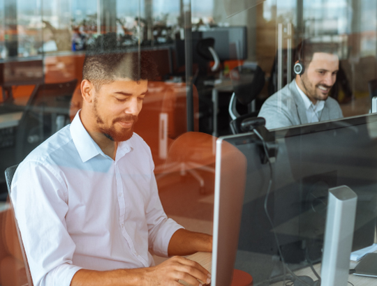 Marketing agency employees working on computers 