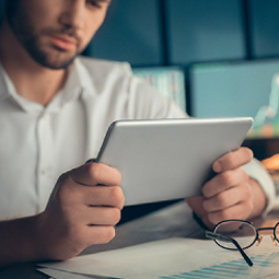  Employee looking at a tablet screen